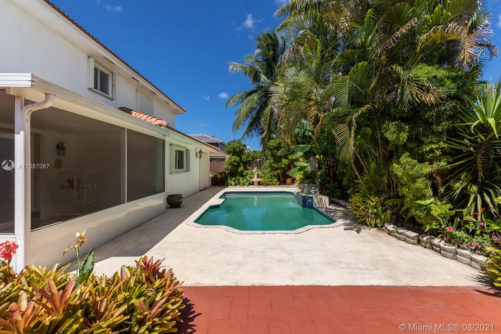18017 Southwest 148th Ave Road Miami, FL 33187 - Photo 20 of 27 a front view of a house with garden
