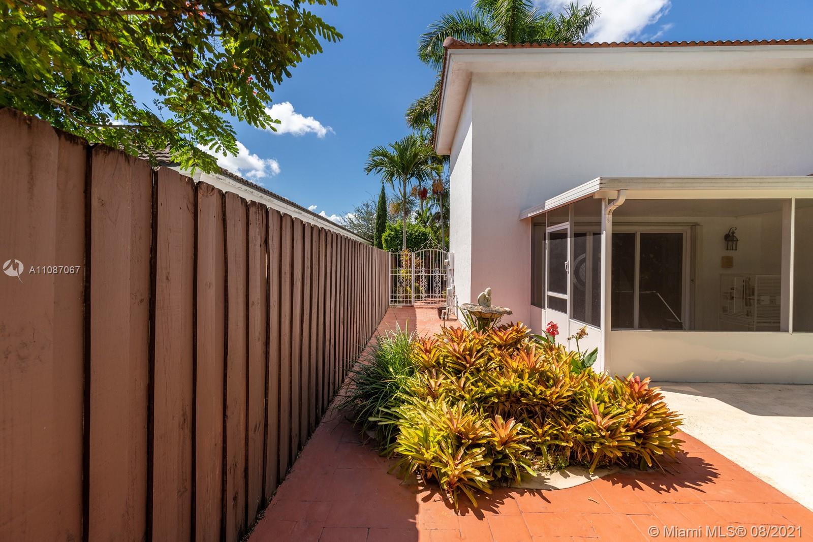 18017 Southwest 148th Ave Road Miami, FL 33187 - Photo 21 of 27 a front view of a house with a yard