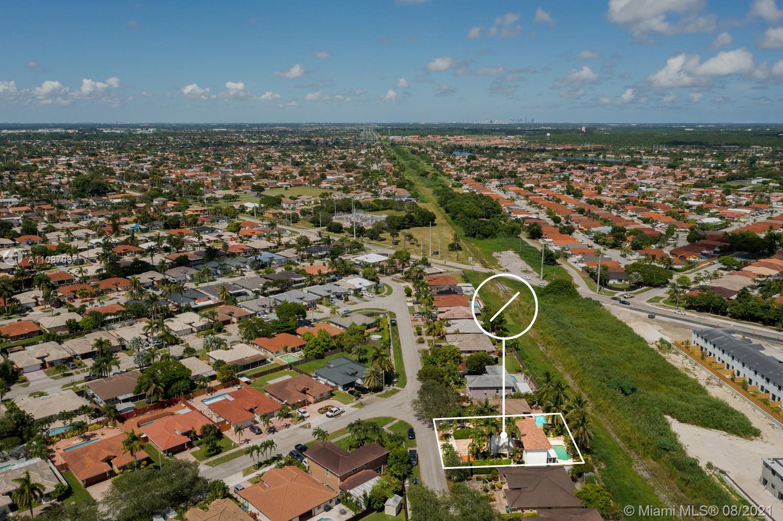 18017 Southwest 148th Ave Road Miami, FL 33187 - Photo 25 of 27 an aerial view of a residential houses with yard