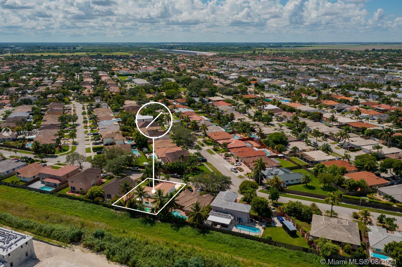 18017 Southwest 148th Ave Road Miami, FL 33187 - Photo 27 of 27 an aerial view of a house with a garden