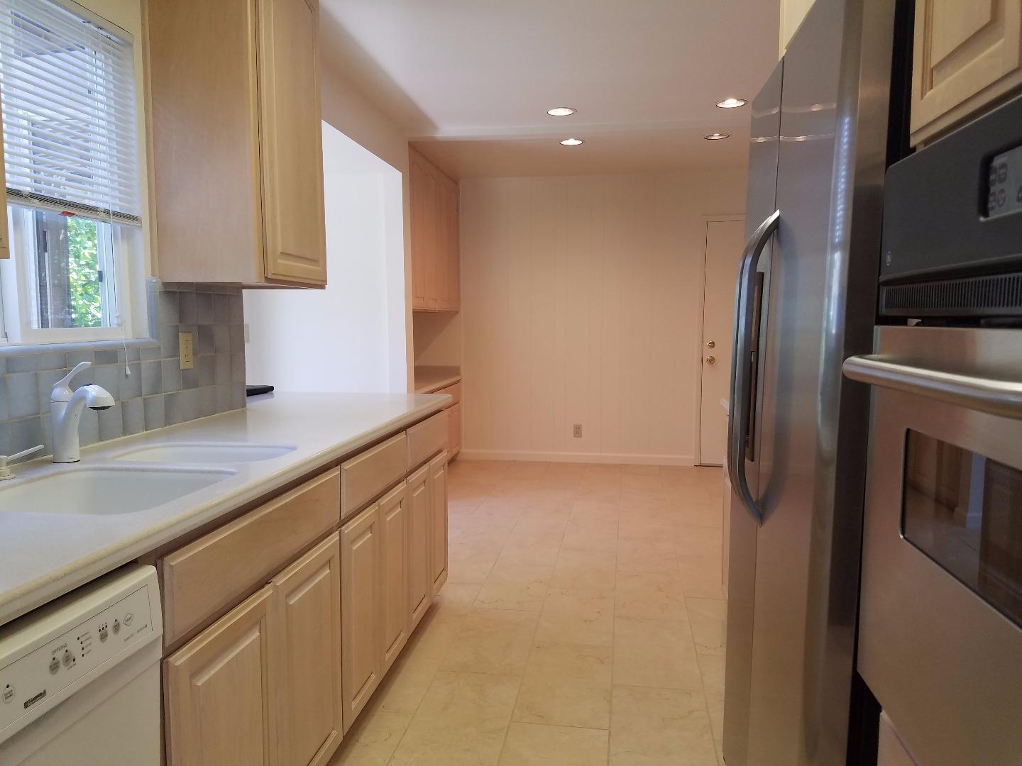 1451 Lewiston Drive Sunnyvale, CA 94087 - Photo 11 of 15 a kitchen with stainless steel appliances granite countertop a refrigerator and a sink