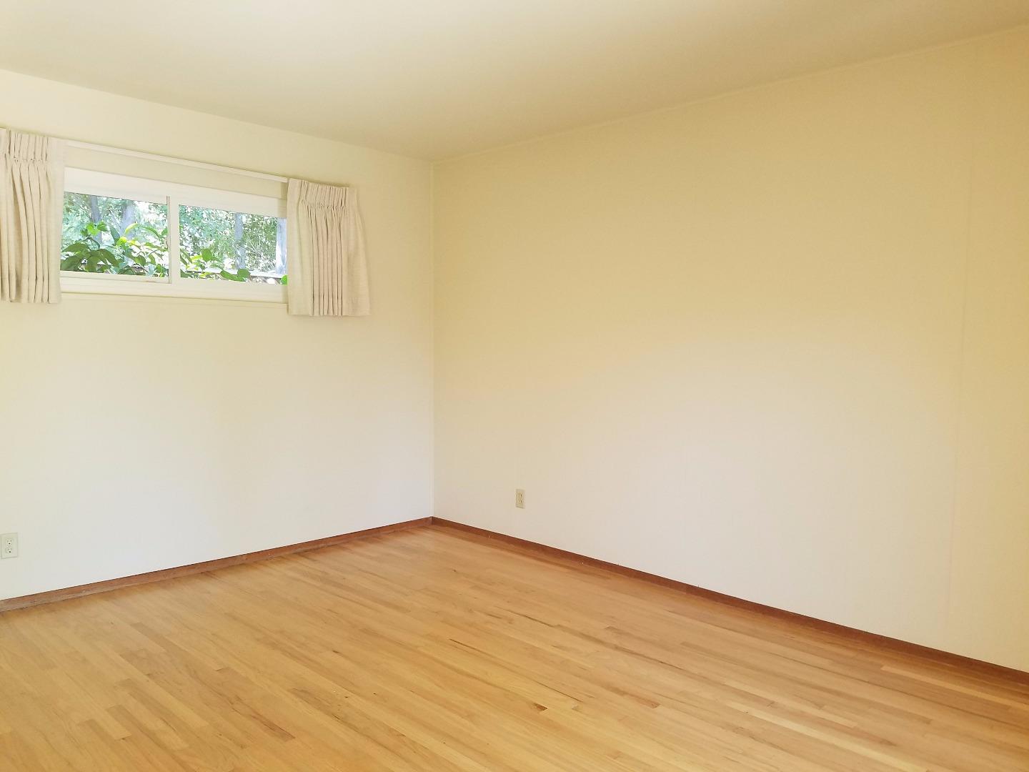 1451 Lewiston Drive Sunnyvale, CA 94087 - Photo 3 of 15 an empty room with wooden floor and windows