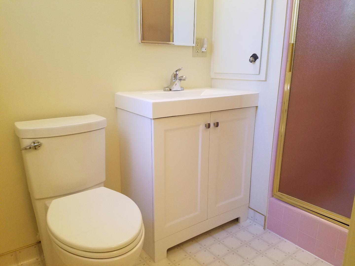 1451 Lewiston Drive Sunnyvale, CA 94087 - Photo 4 of 15 a white toilet sitting next to a bathroom sink