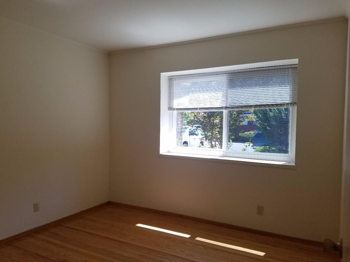 1451 Lewiston Drive Sunnyvale, CA 94087 - Photo 6 of 15 an empty room with wooden floor and a window