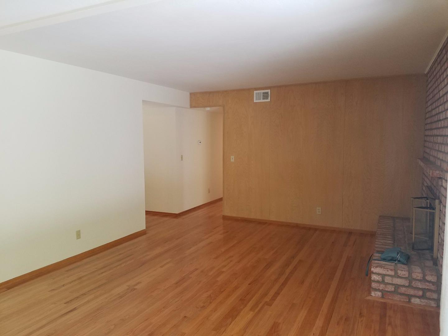 1451 Lewiston Drive Sunnyvale, CA 94087 - Photo 8 of 15 a view of an empty room with wooden floor