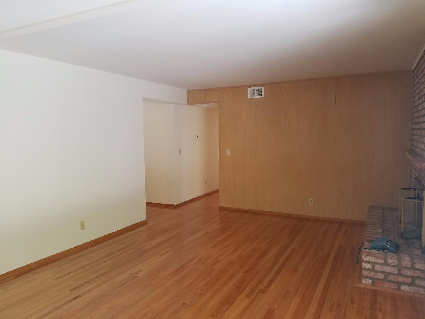1451 Lewiston Drive Sunnyvale, CA 94087 - Photo 9 of 15 a view of an empty room with wooden floor