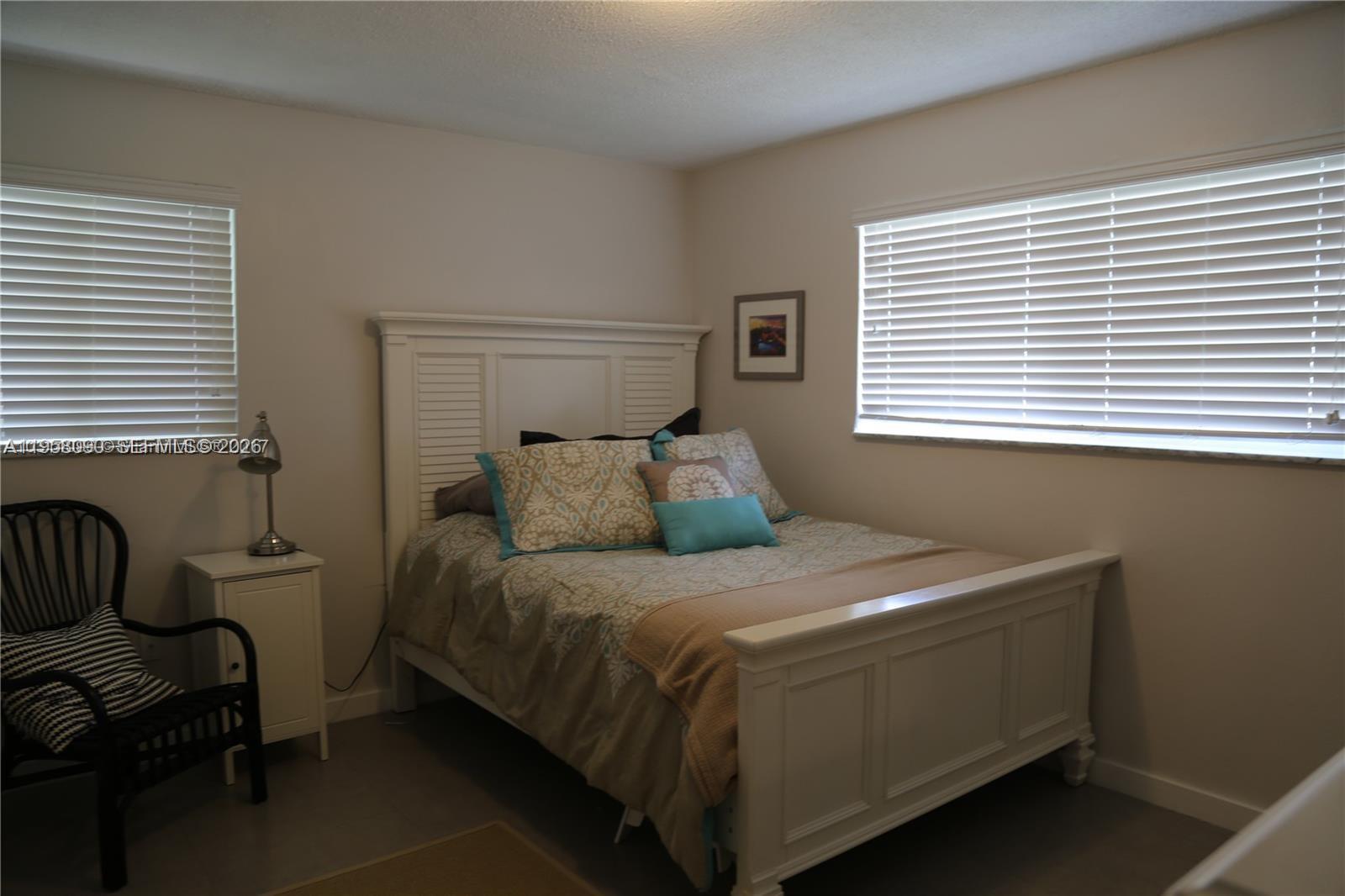 8940 Southwest 95th Avenue Miami, FL 33176 - Photo 14 of 21 a bedroom with a bed and a window