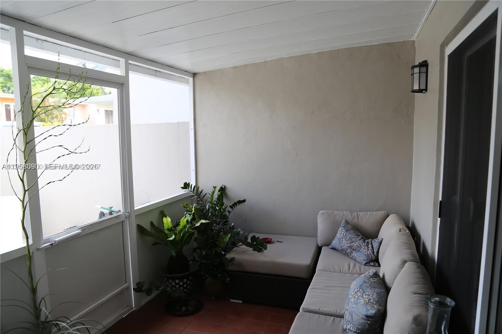 8940 Southwest 95th Avenue Miami, FL 33176 - Photo 17 of 21 a living room with furniture and a potted plant