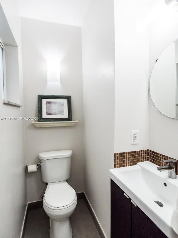 8940 Southwest 95th Avenue Miami, FL 33176 - Photo 8 of 21 a bathroom with a sink mirror and toilet
