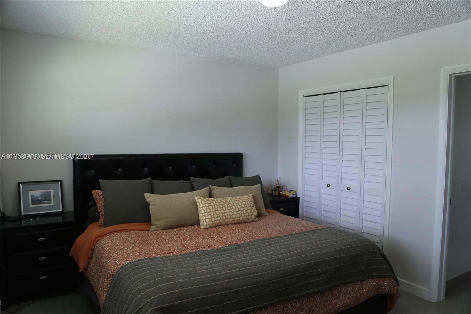 8940 Southwest 95th Avenue Miami, FL 33176 - Photo 10 of 21 a bedroom with a bed and wooden floor