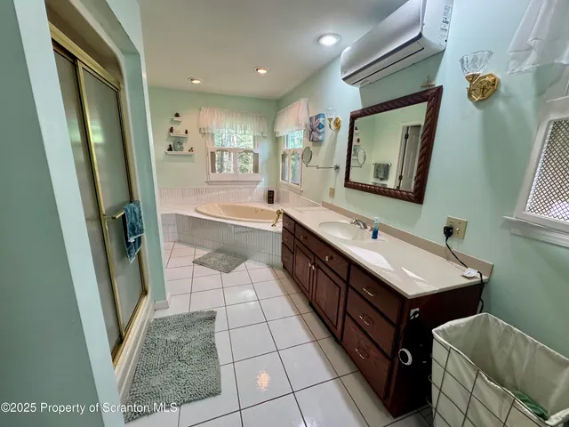 a bathroom with a sink a mirror and a bathtub