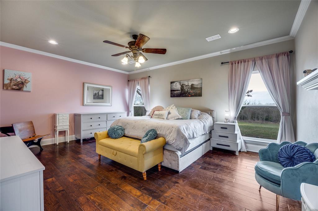 1462 Durham Road Whitewright, TX 75491 - Photo 14 of 40 a spacious bedroom with a bed and furniture