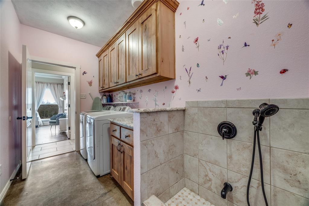 1462 Durham Road Whitewright, TX 75491 - Photo 19 of 40 a bathroom with a sink a mirror and shower