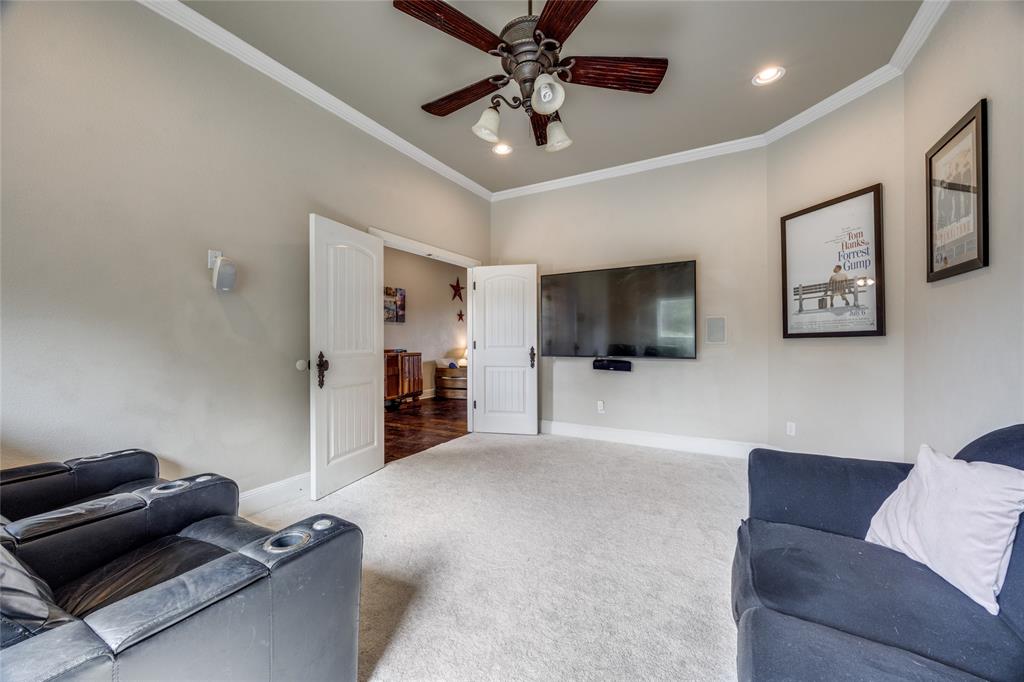 1462 Durham Road Whitewright, TX 75491 - Photo 21 of 40 a living room with furniture and a flat screen tv
