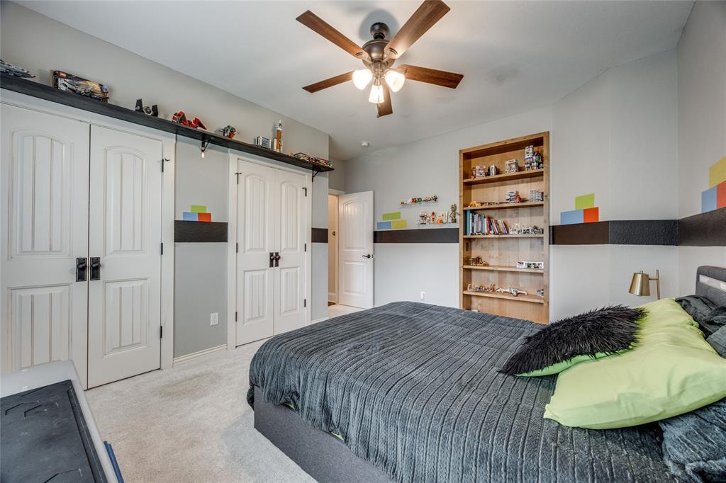 1462 Durham Road Whitewright, TX 75491 - Photo 23 of 40 a bedroom with a bed cabinets and a window