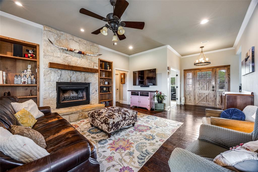 1462 Durham Road Whitewright, TX 75491 - Photo 3 of 40 a living room with furniture and a fireplace