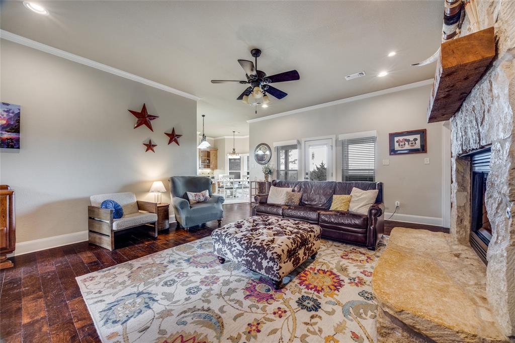 1462 Durham Road Whitewright, TX 75491 - Photo 8 of 40 a living room with furniture or couch and a fireplace