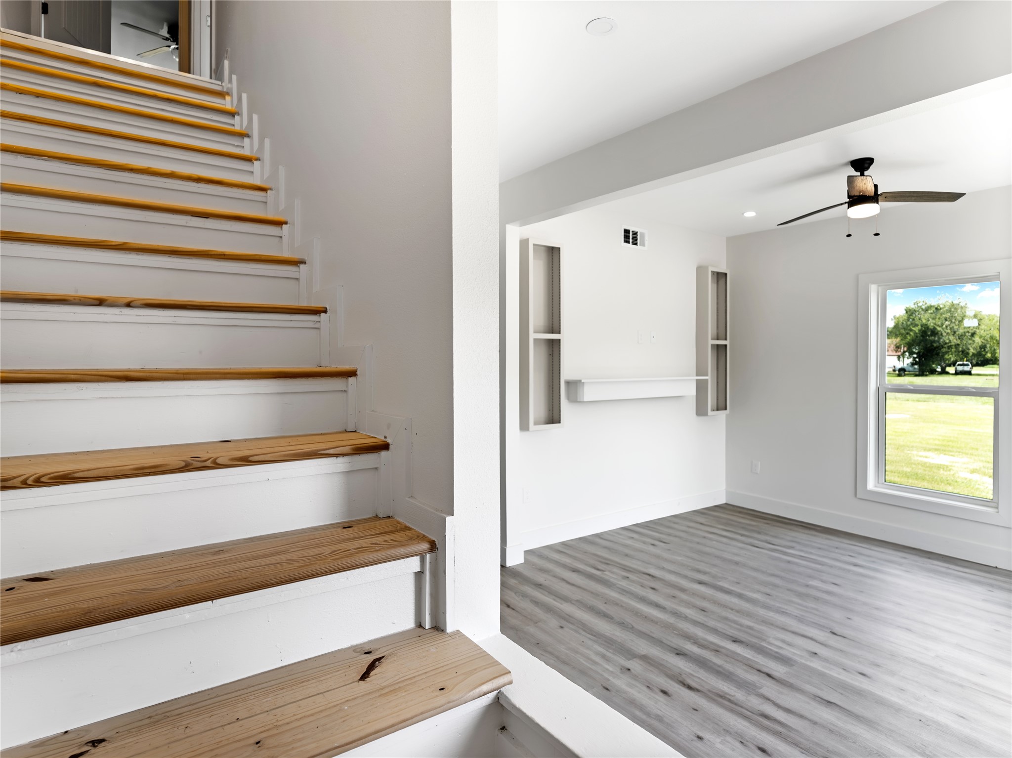 1014 Humphrey Street Palacios, TX 77465 - Photo 12 of 26 a view of empty room with wooden floor and fan