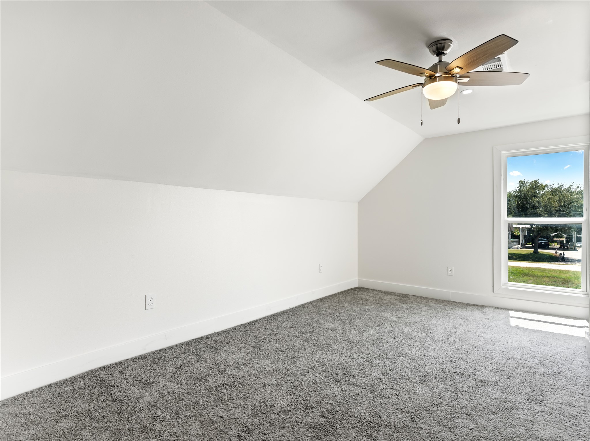 1014 Humphrey Street Palacios, TX 77465 - Photo 13 of 26 an empty room with a ceiling fan and a window