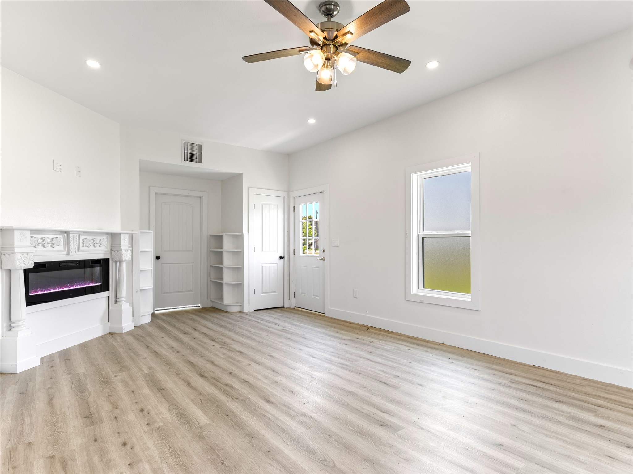 1014 Humphrey Street Palacios, TX 77465 - Photo 17 of 26 a view of an empty room with a window and a kitchen