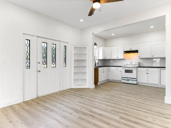a white toilet sitting next to a bath tub shower