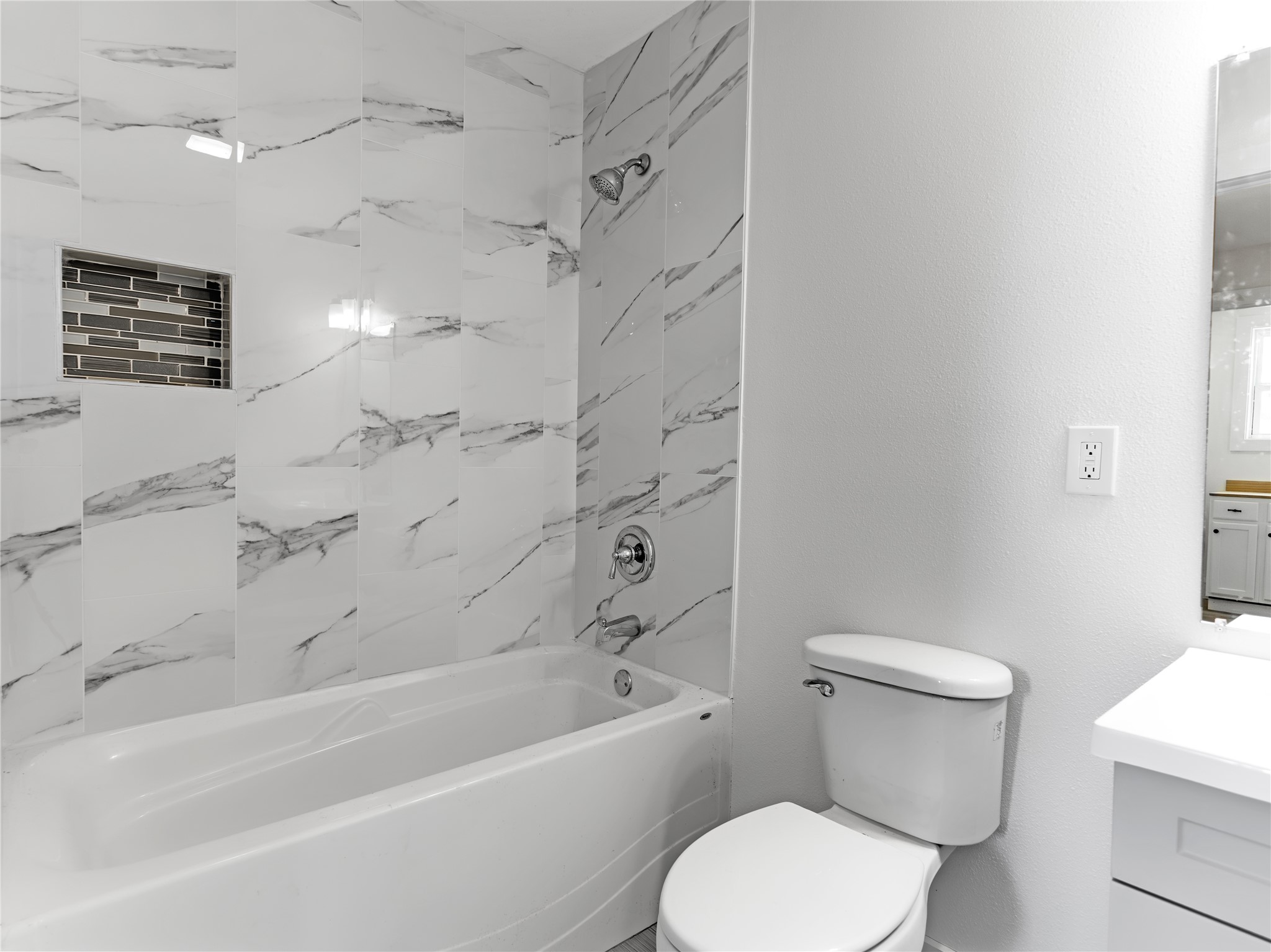 1014 Humphrey Street Palacios, TX 77465 - Photo 22 of 26 a white toilet sitting next to a bath tub shower