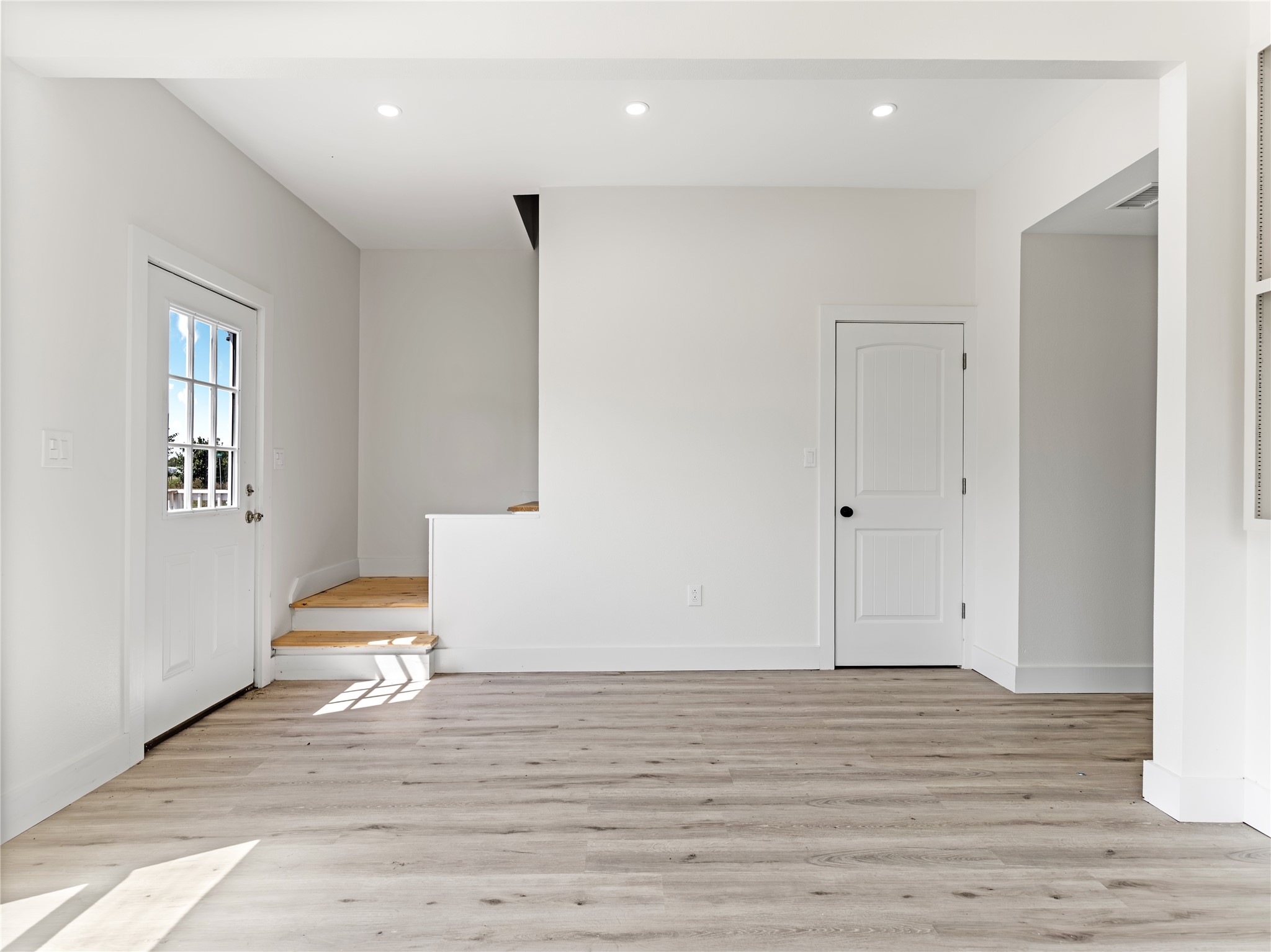 1014 Humphrey Street Palacios, TX 77465 - Photo 25 of 26 a view of an empty room with wooden floor