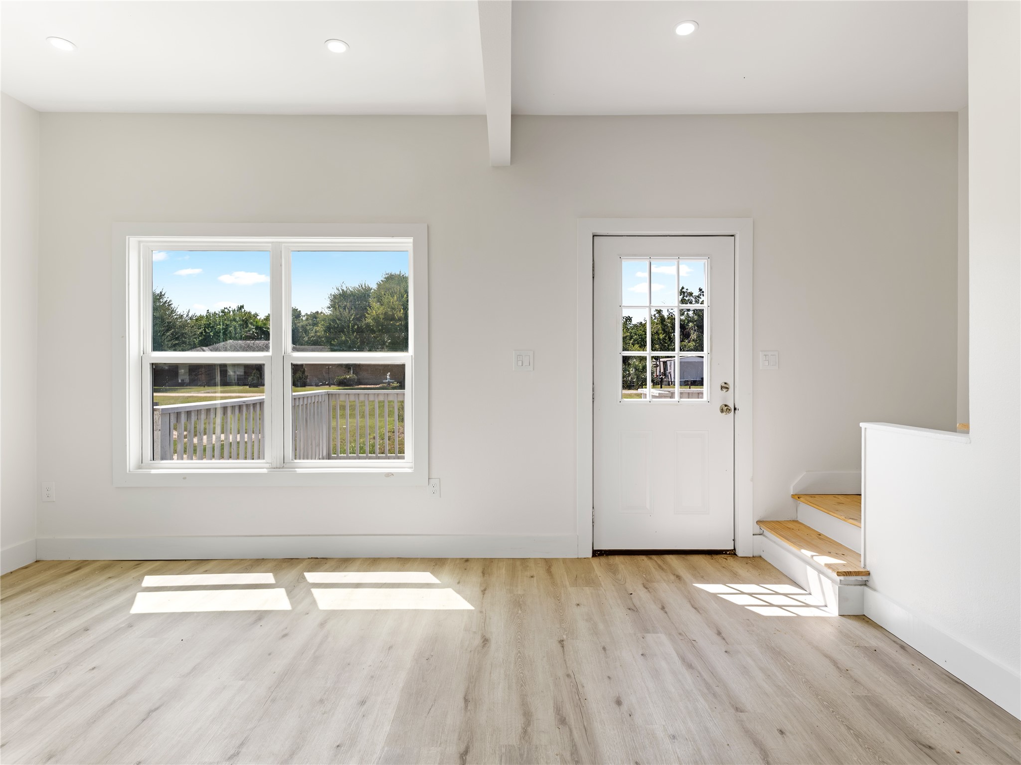 1014 Humphrey Street Palacios, TX 77465 - Photo 26 of 26 an empty room with wooden floor and windows