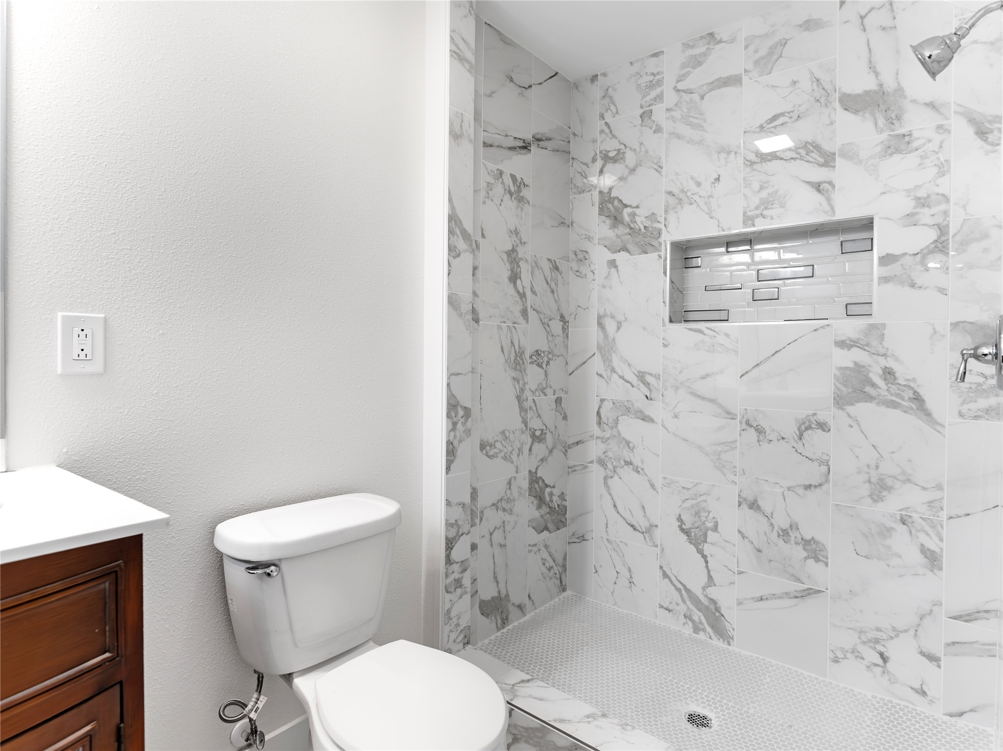 1014 Humphrey Street Palacios, TX 77465 - Photo 4 of 26 a white toilet sitting next to a bath tub