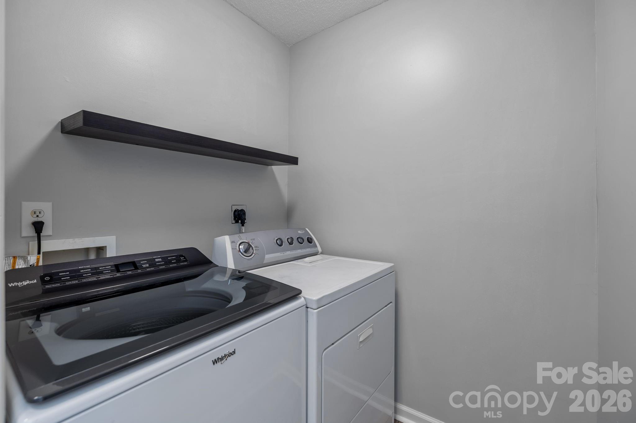 213 Butler Place Fort Mill, SC 29715 - Photo 13 of 36 a utility room with dryer and washer