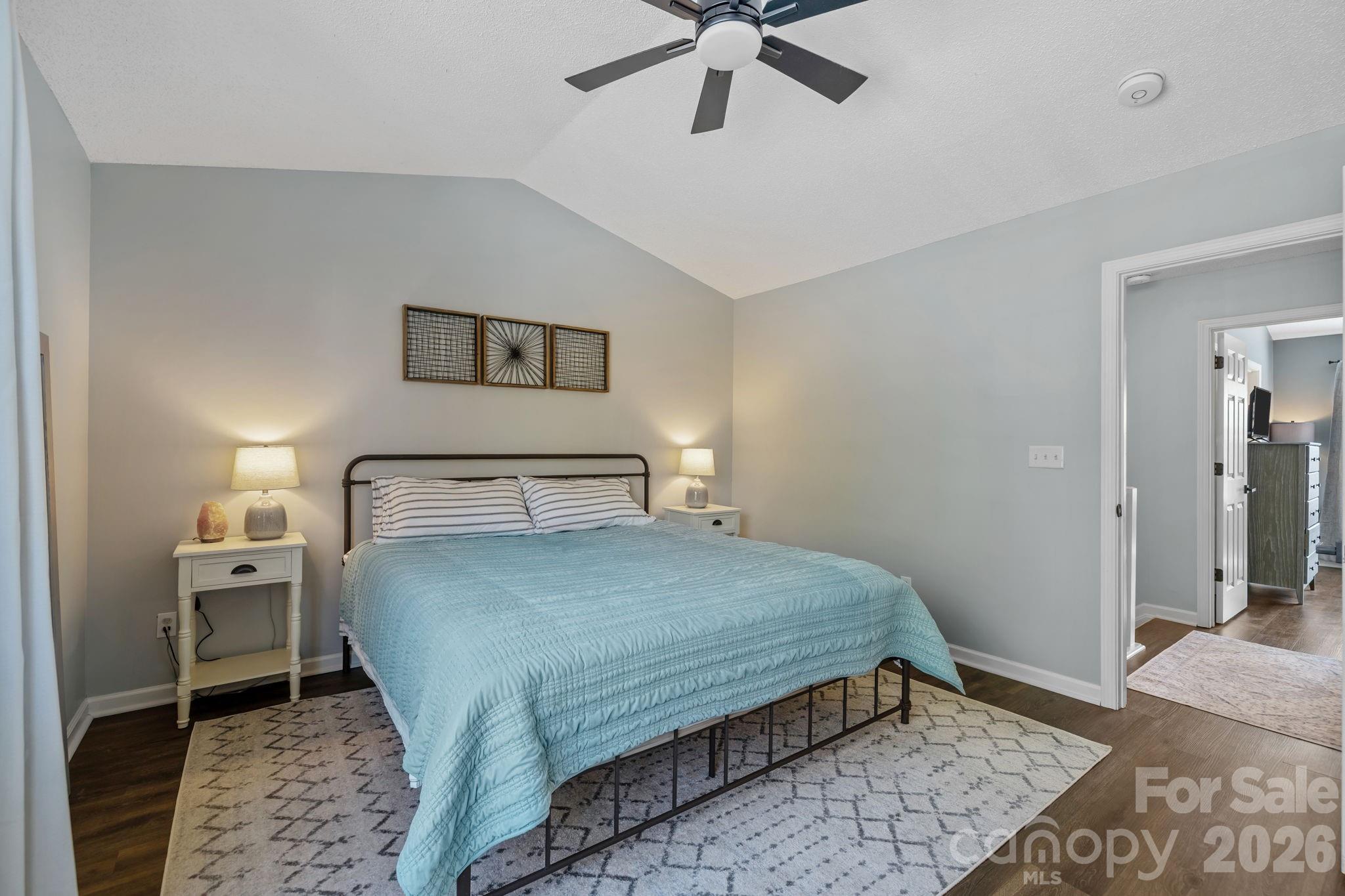 213 Butler Place Fort Mill, SC 29715 - Photo 16 of 36 a bedroom with a bed and a table