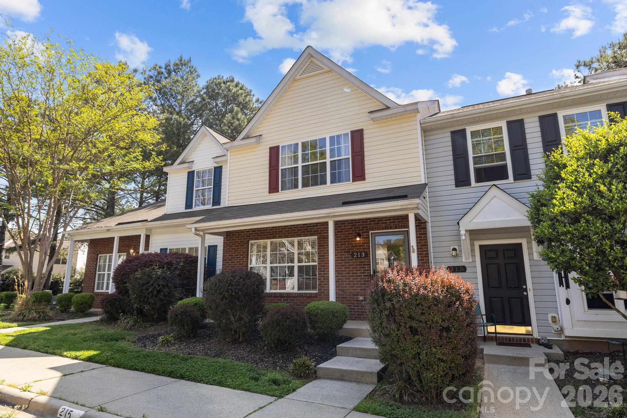 213 Butler Place Fort Mill, SC 29715 - Photo 2 of 36 a front view of a house with a yard and outdoor seating