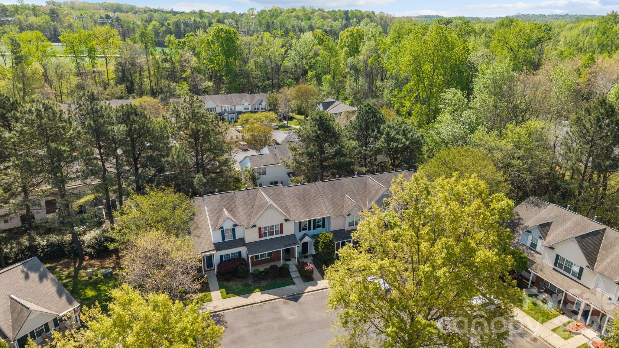 213 Butler Place Fort Mill, SC 29715 - Photo 27 of 36 an aerial view of a house with a yard