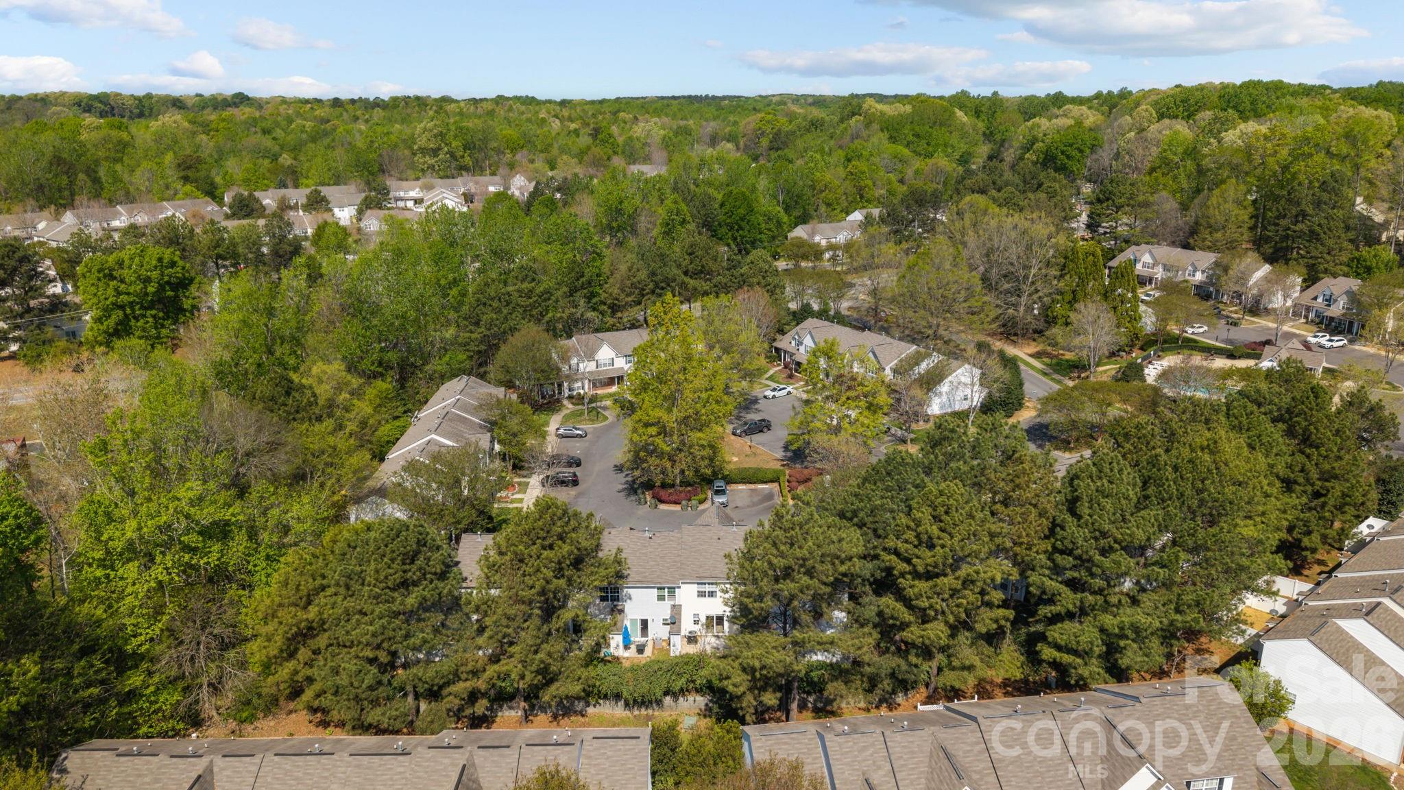 213 Butler Place Fort Mill, SC 29715 - Photo 31 of 36 an aerial view of residential houses with outdoor space and trees