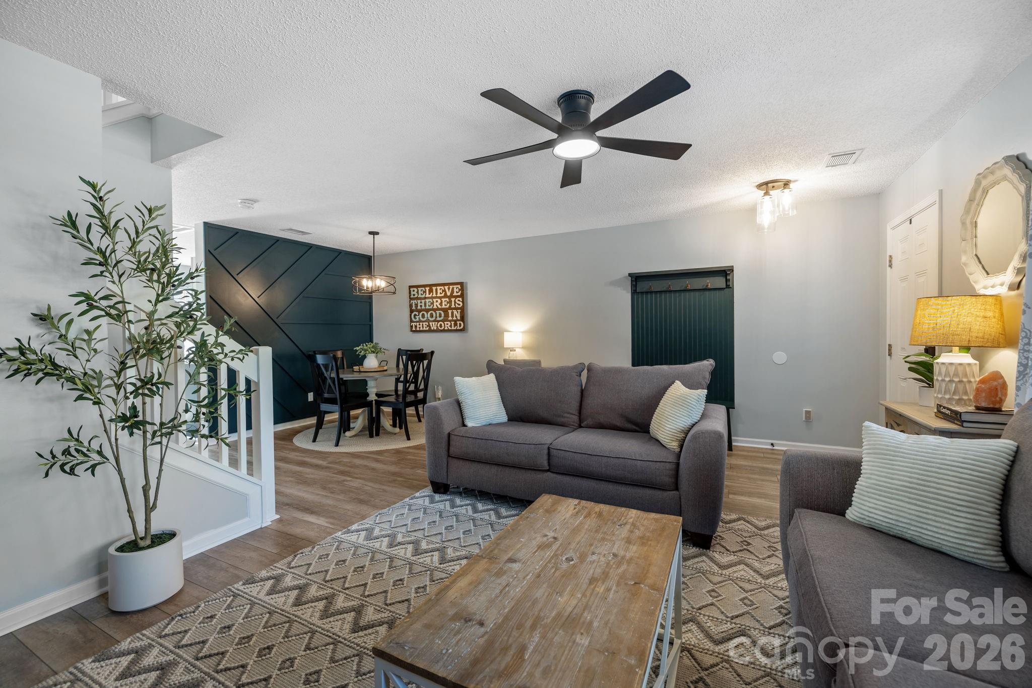 213 Butler Place Fort Mill, SC 29715 - Photo 6 of 36 a living room with furniture and a potted plant