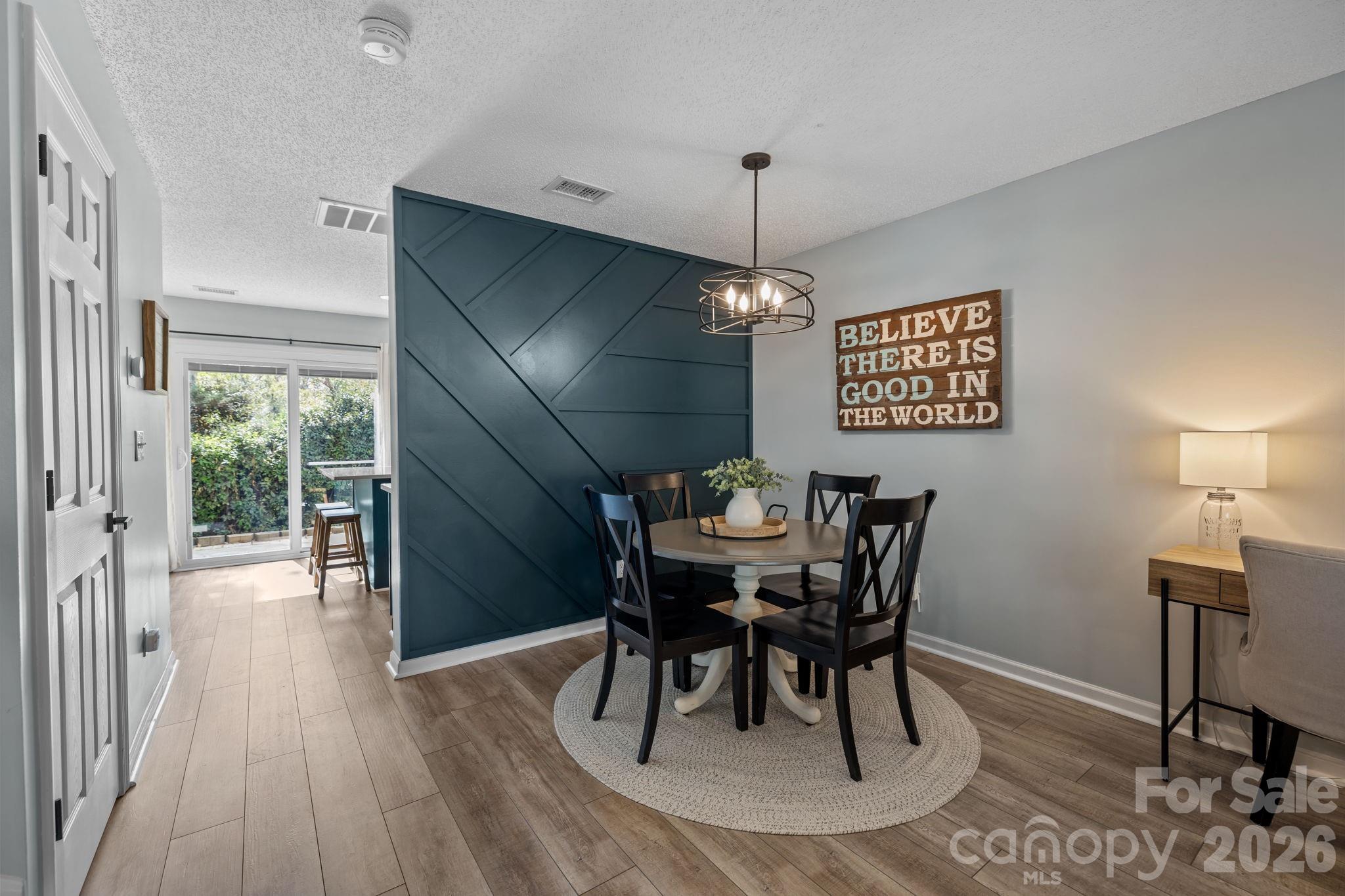 213 Butler Place Fort Mill, SC 29715 - Photo 8 of 36 a view of a dining room with furniture window and wooden floor