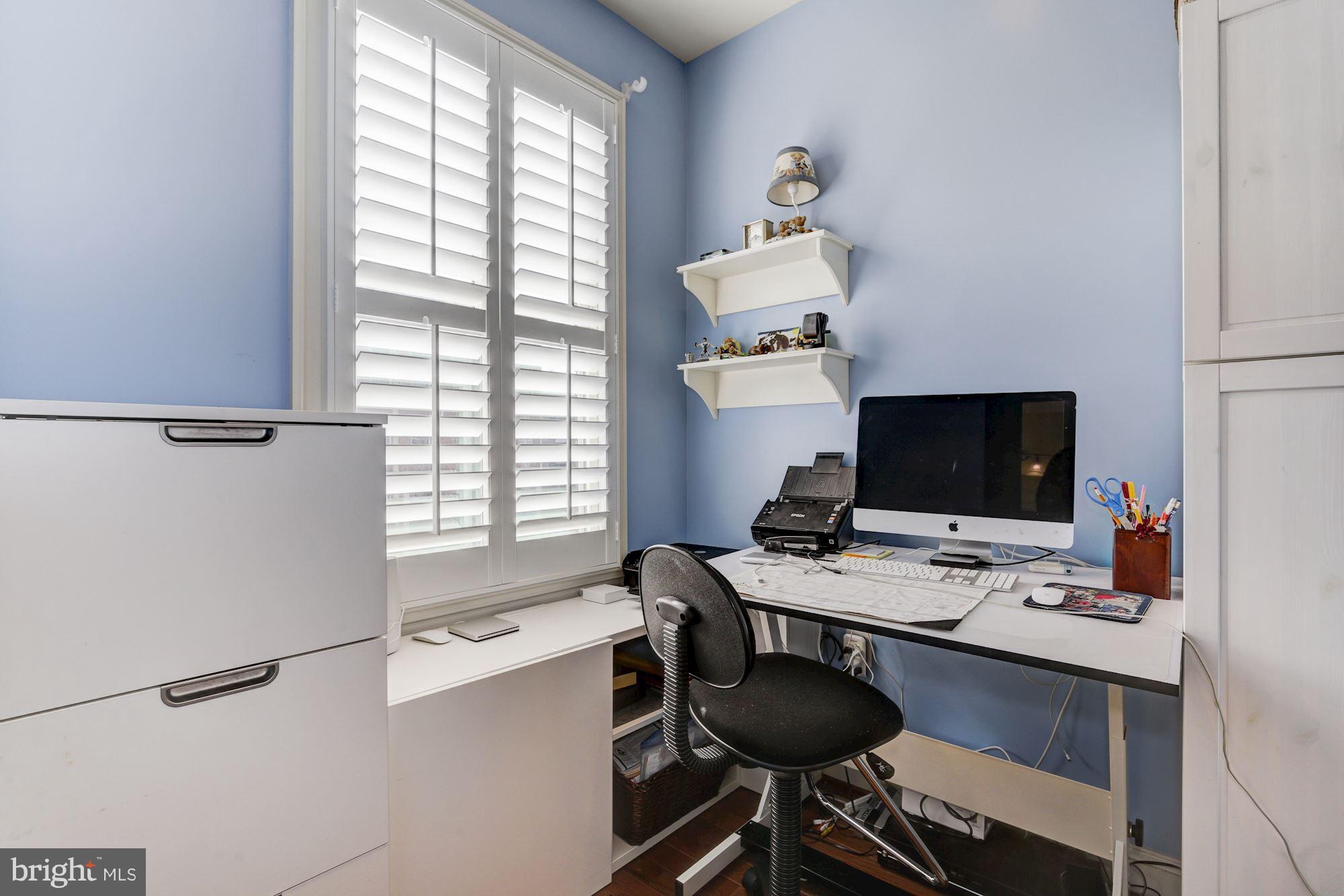 648 C Street Northeast Washington, DC 20002 - Photo 13 of 22 a view of a workspace with furniture and a window