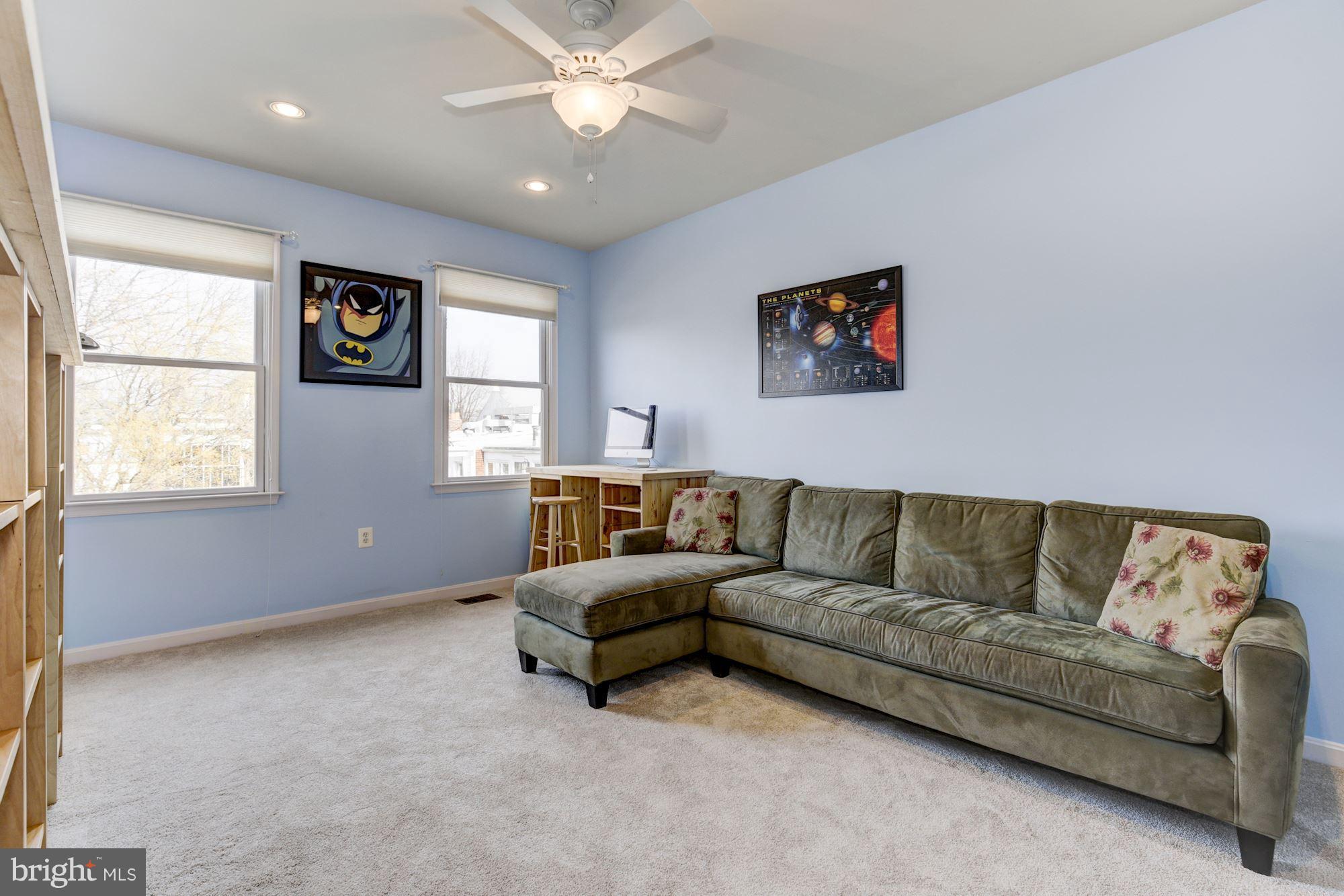 648 C Street Northeast Washington, DC 20002 - Photo 14 of 22 a living room with furniture and a window