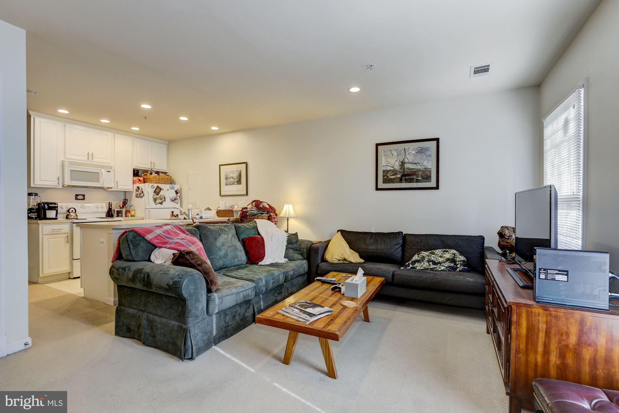 648 C Street Northeast Washington, DC 20002 - Photo 17 of 22 a living room with furniture and a flat screen tv