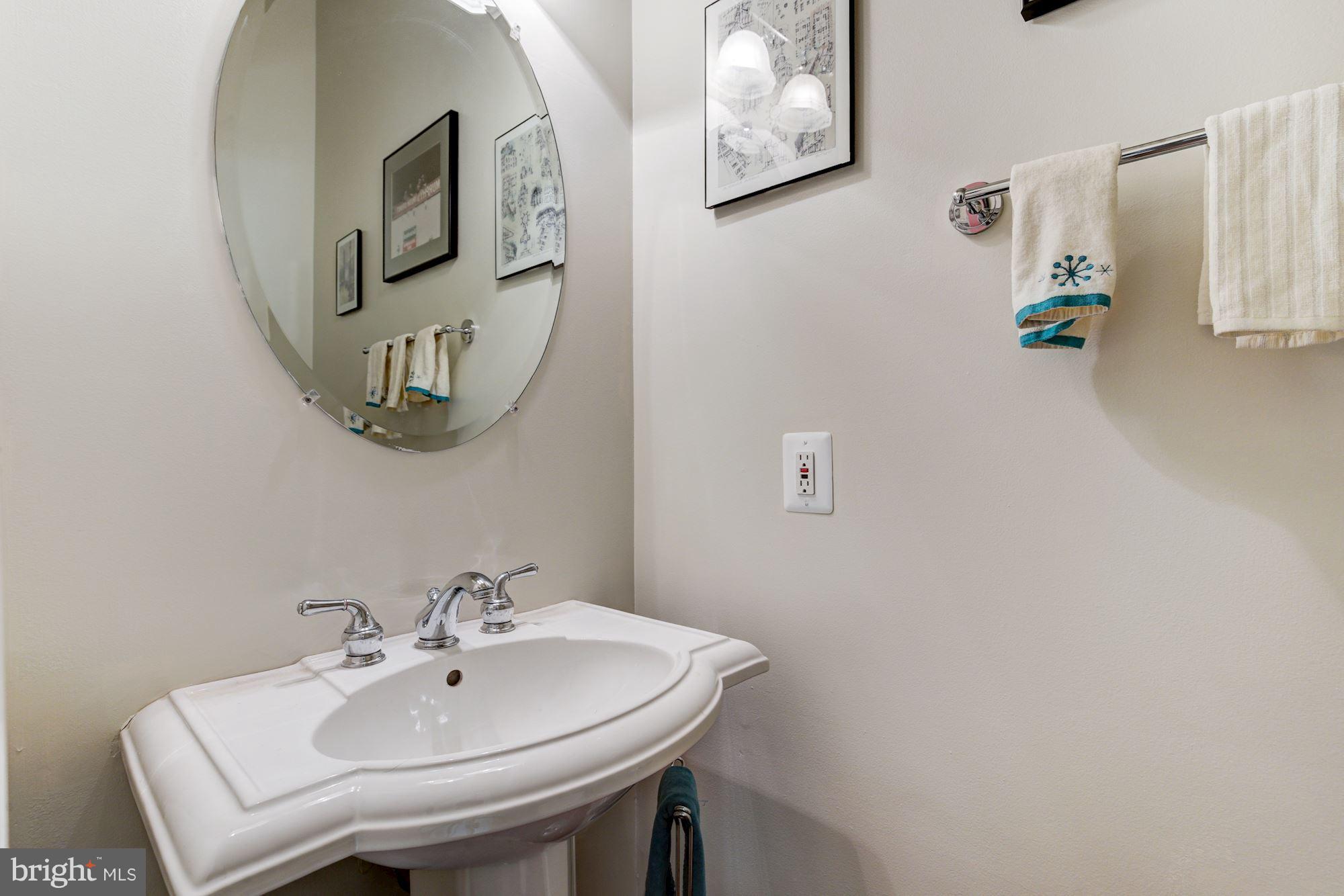 648 C Street Northeast Washington, DC 20002 - Photo 9 of 22 a bathroom with a sink and mirror
