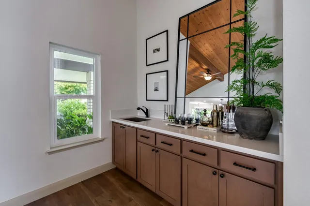 a kitchen with a sink and a window