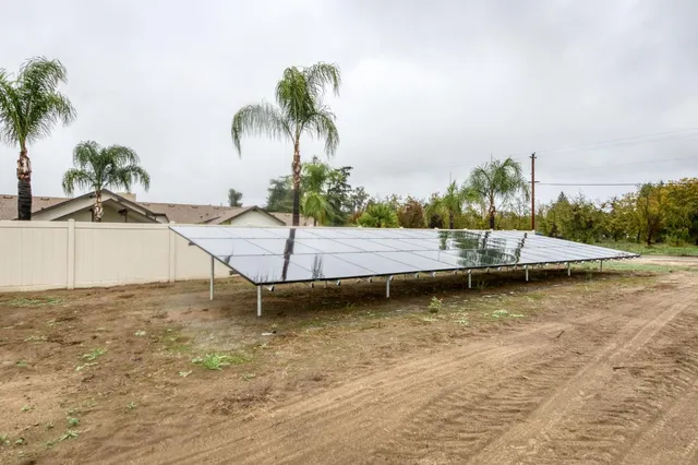 a view of a swimming pool with a table and chairs