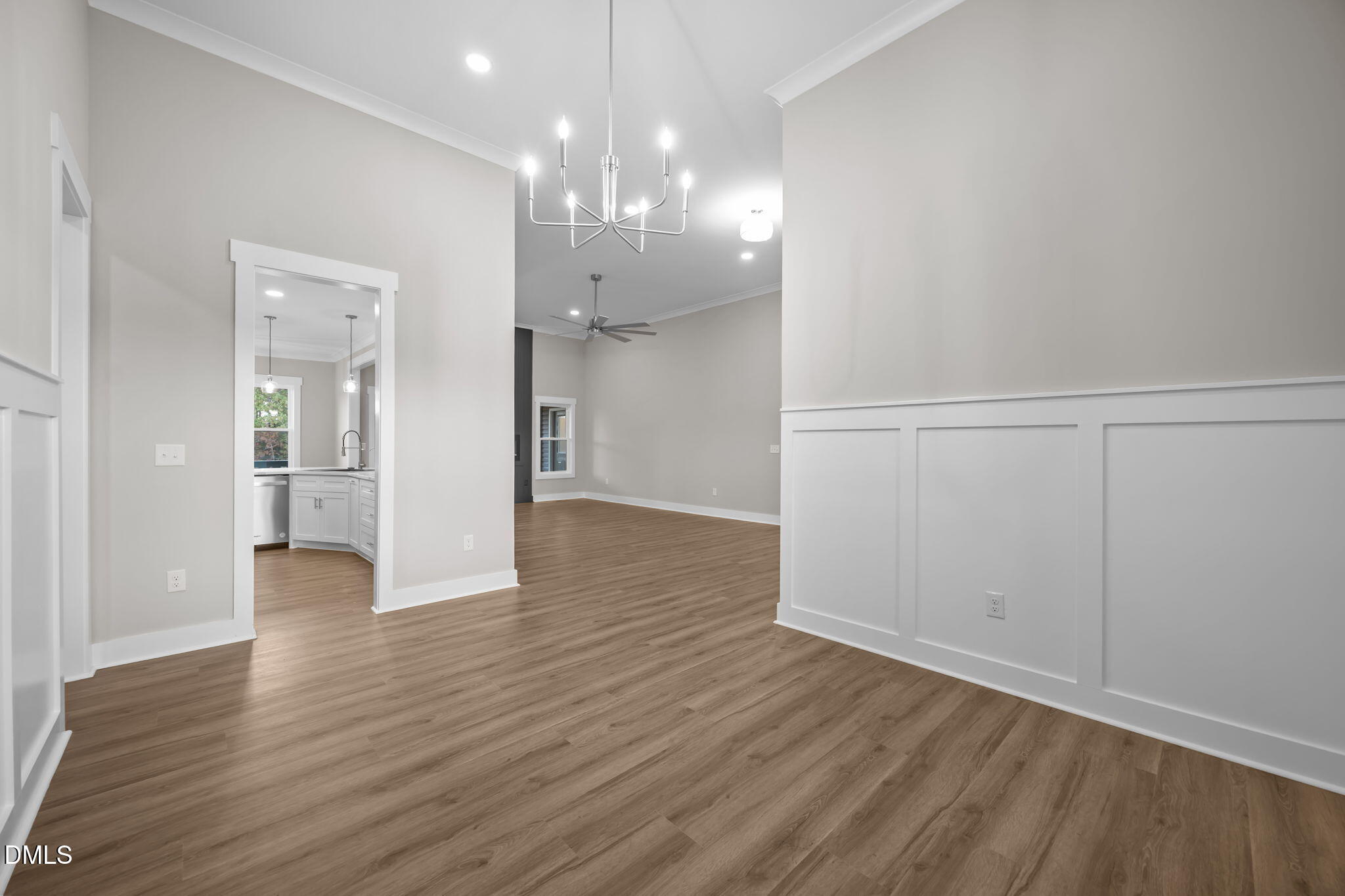 8629 Dukes Lake Road Zebulon, NC 27597 - Photo 13 of 52 a view of an empty room with wooden floor