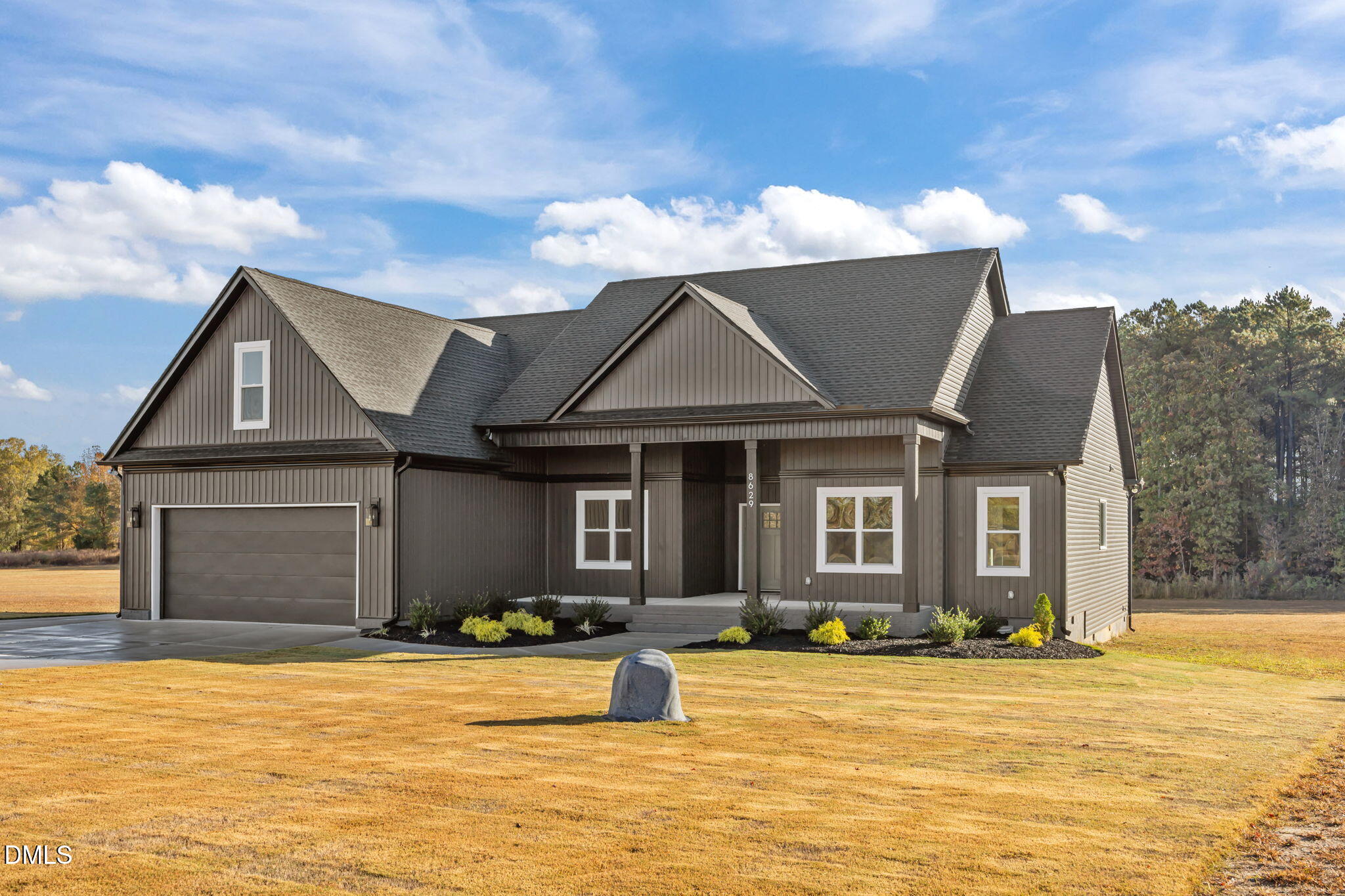 8629 Dukes Lake Road Zebulon, NC 27597 - Photo 2 of 52 a front view of a house with a yard