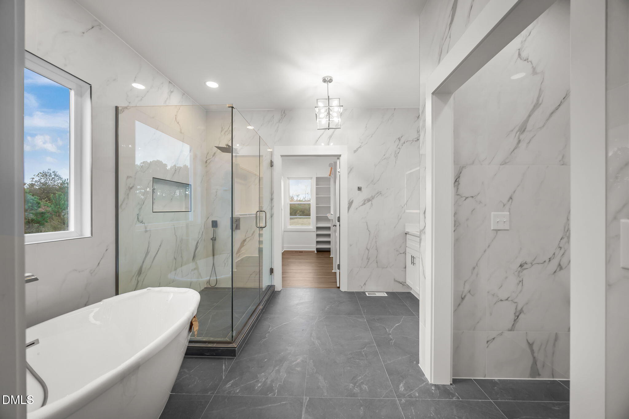 8629 Dukes Lake Road Zebulon, NC 27597 - Photo 23 of 52 a bathroom with a bathtub shower and toilet