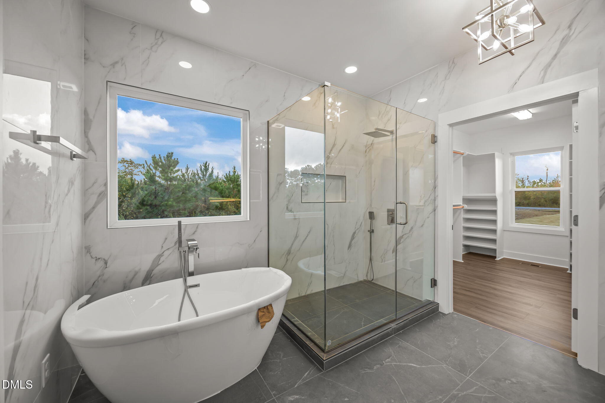 8629 Dukes Lake Road Zebulon, NC 27597 - Photo 24 of 52 a spacious bathroom with a tub a shower and view