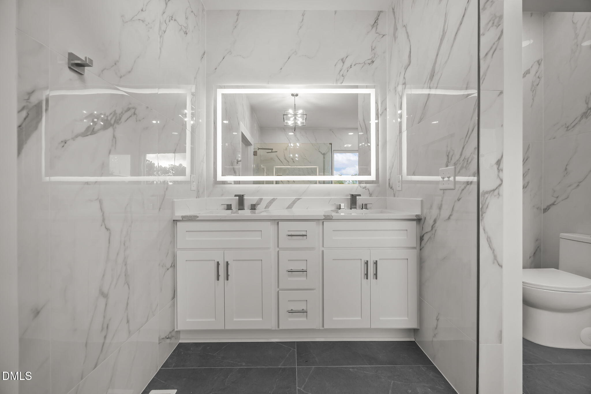 8629 Dukes Lake Road Zebulon, NC 27597 - Photo 25 of 52 a bathroom with a sink and a mirror
