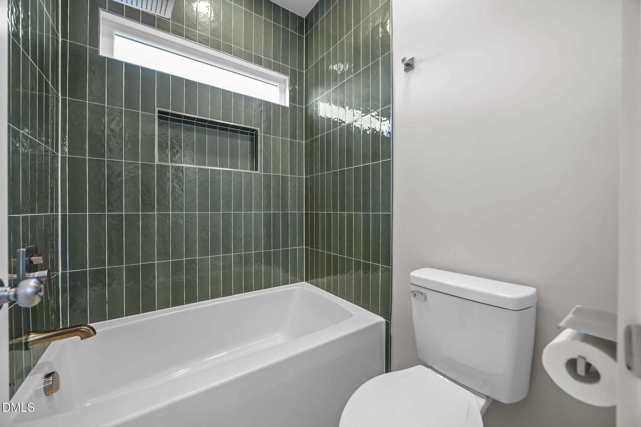 8629 Dukes Lake Road Zebulon, NC 27597 - Photo 30 of 52 a bathroom with a toilet and bathtub