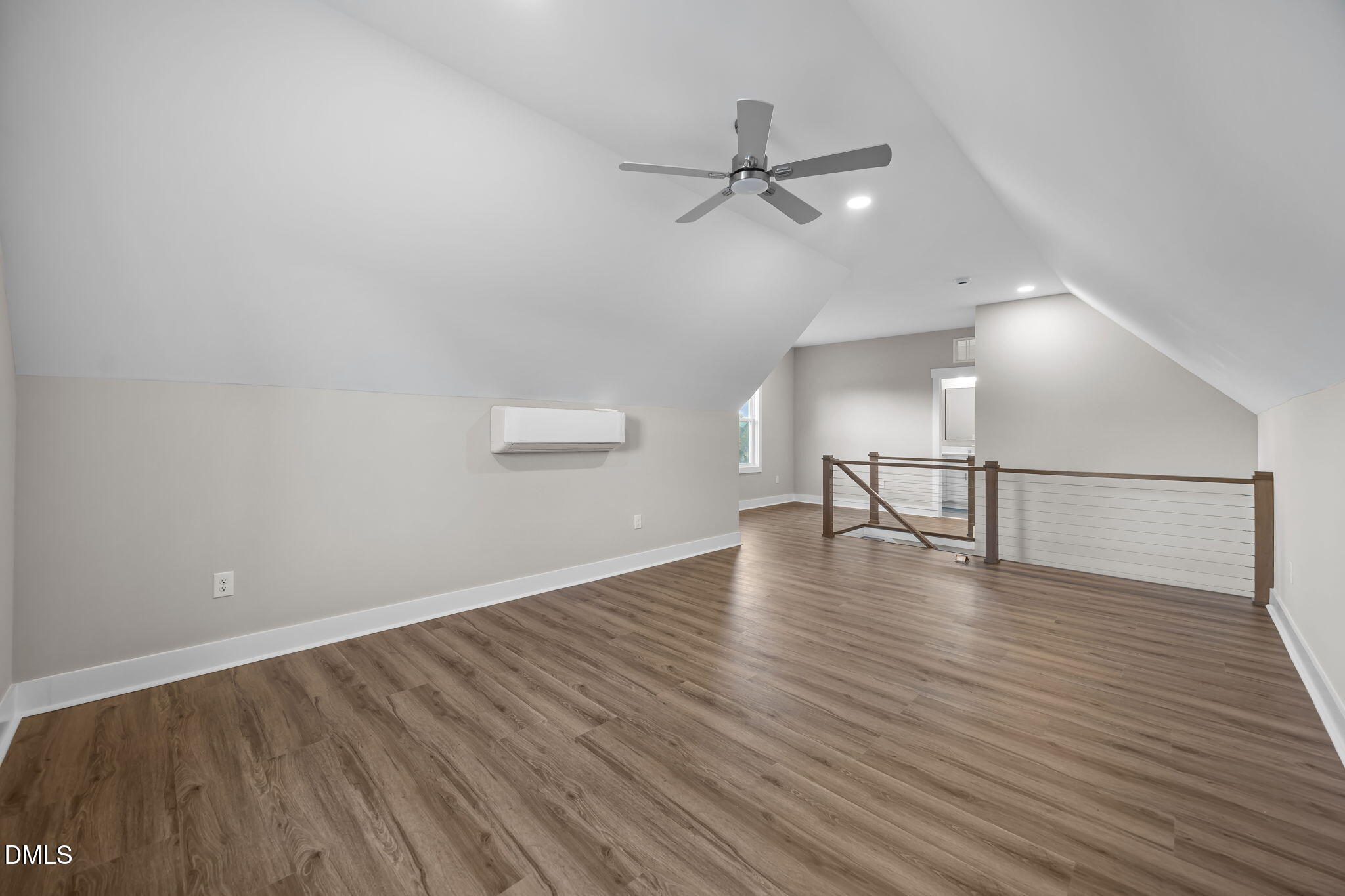 8629 Dukes Lake Road Zebulon, NC 27597 - Photo 33 of 52 a view of empty room with wooden floor and fan