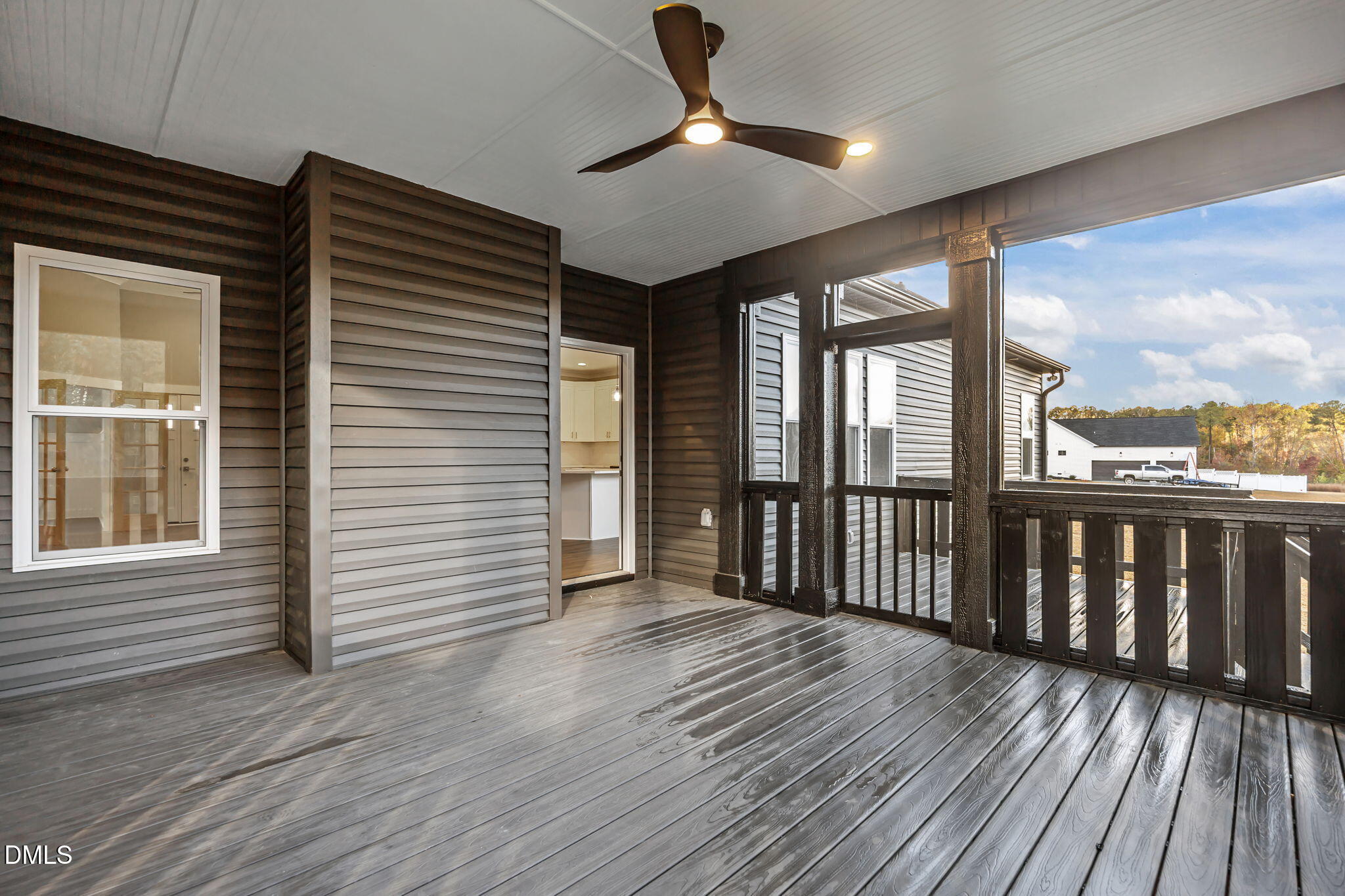 8629 Dukes Lake Road Zebulon, NC 27597 - Photo 36 of 52 a view of a balcony with wooden floor